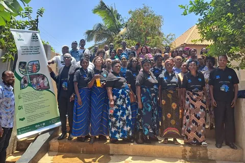 Group photo of CBTA trainees in matching branded shirts at a training event in Nakonde