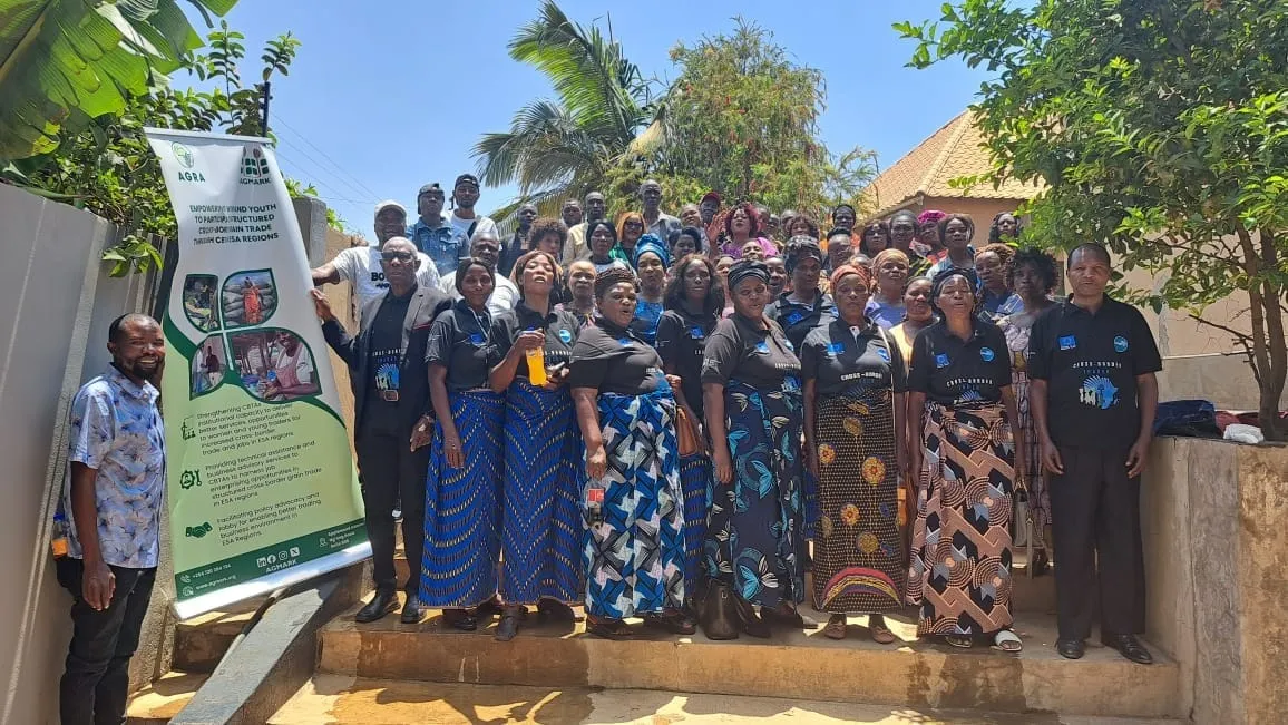 Group photo of CBTA trainees in matching branded shirts at a training event in Nakonde