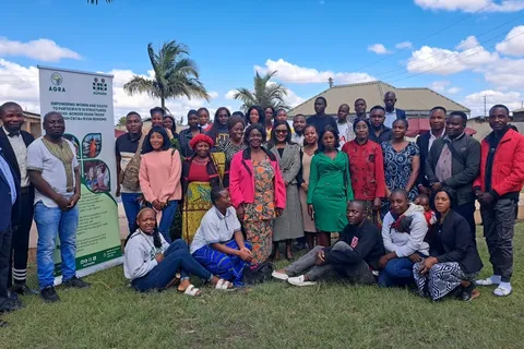 Group photo of grain trade skills training participants outdoors in Nakonde, Zambia