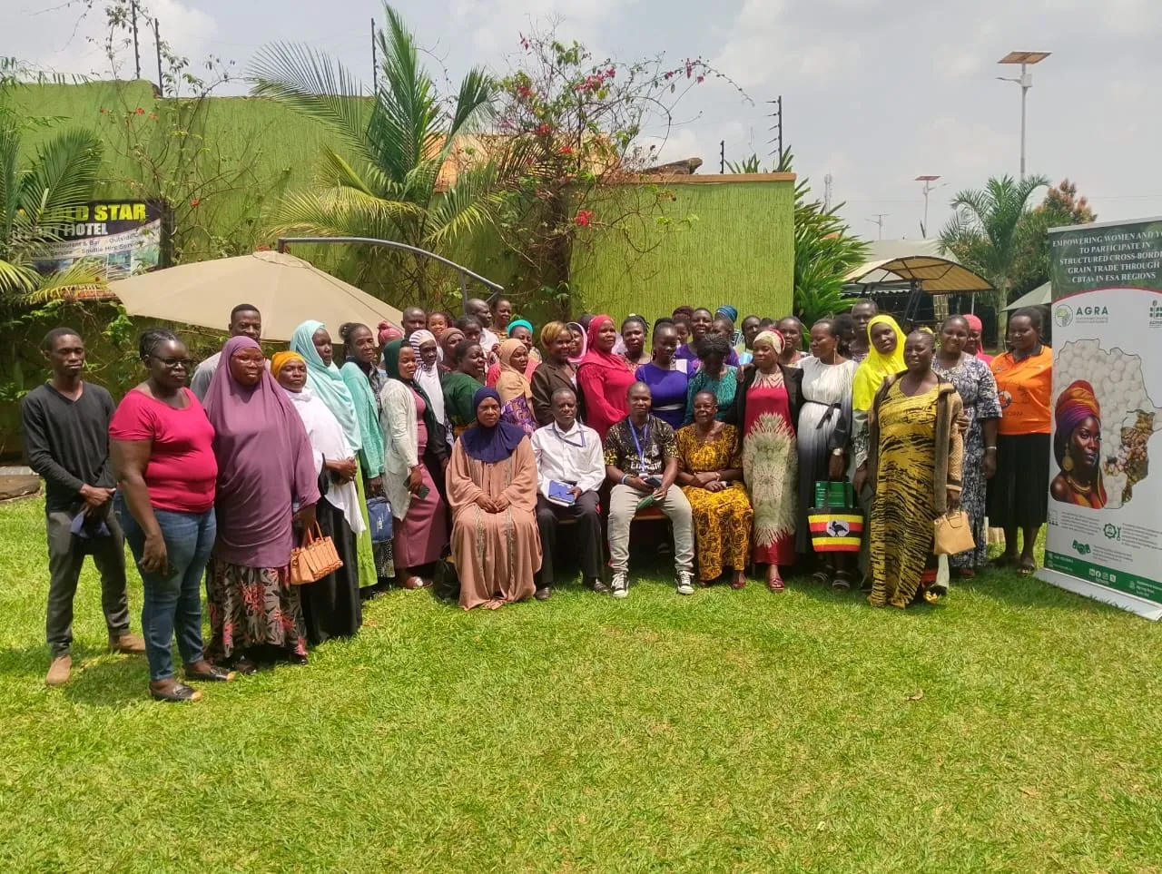 Group photo of women cross-border grain traders at a training event in Busia, Uganda