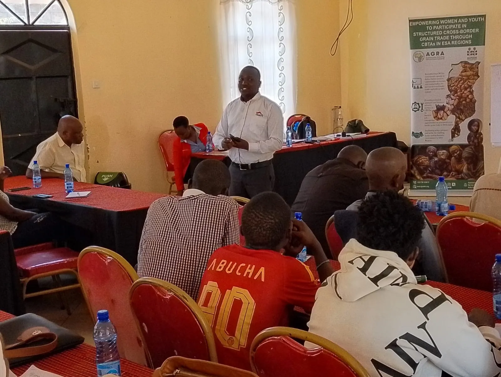 Equity Bank Namanga station manager addressing traders on account and loan products